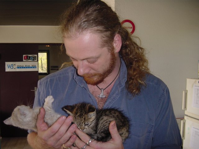 Charles holding Pichu and Emu in each hand