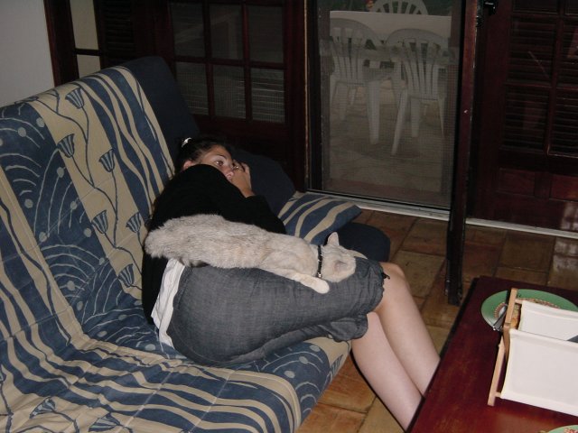 Coralie and Emu sprawled on the couch