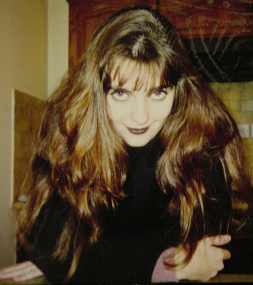 Portrait of Coralie wearing dark make-up, Halloween 1996