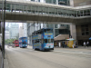 Three double-decker busses in a row