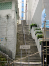 A long flight of stairs between two builings