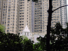 Chruch in front of huge and large blocks of flats