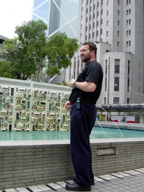 Daniel in front of the fountain, faking a pee