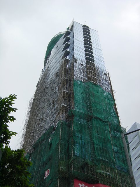 Huge glass skyscraper being renovated