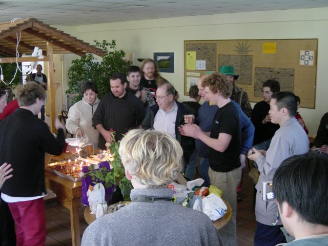 The team helping themselves with cookies and pastries