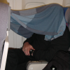 Daniel hiding/sleeping under a blanket