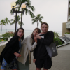Christelle and Caroline leaning on Max's shoulder
