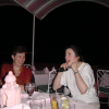 At the restaurant: Marie-Claire laughing and Janet covering her ears
