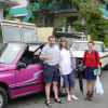 At the car rental: our rental, a flashy pink 4WD, Daniel, Caroline and Christelle