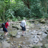 Christelle using the stick in the stream, Daniel