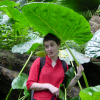 Christelle holding an umbrella like leaf