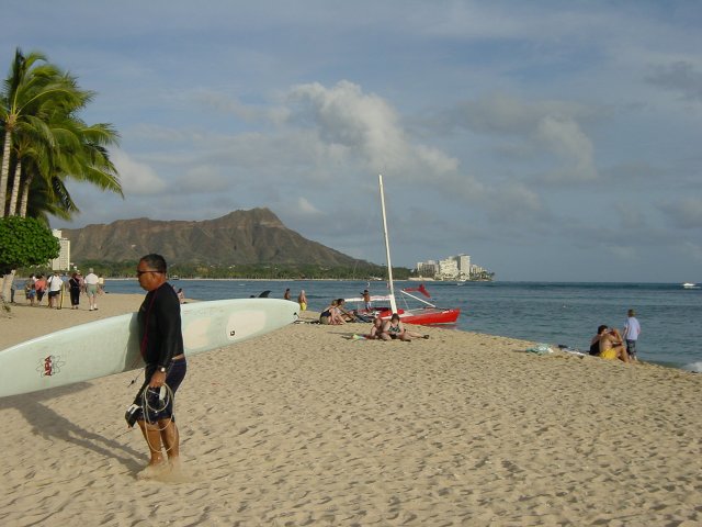 Surfer on the sand, Diamond Head in the background