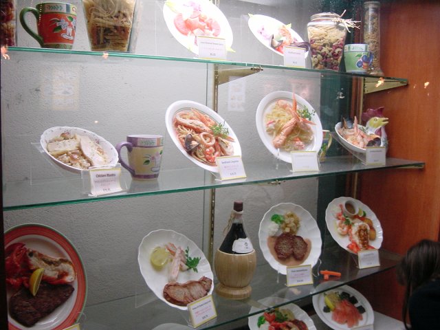 Window of a Japanese restaurant, fake (wax) food in display