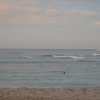 The beach, the ocean, waves and a boat