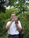 Yves proudly holding his brand new digital camera