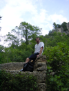 Daniel sitting on the edge of the bridge