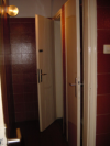 The bathroom: narrow passage to the stalls