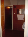 The bathroom: sinks area and door to the toilets