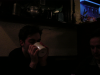 Olivier drinking hot chocolate from a mug, Yves on the right