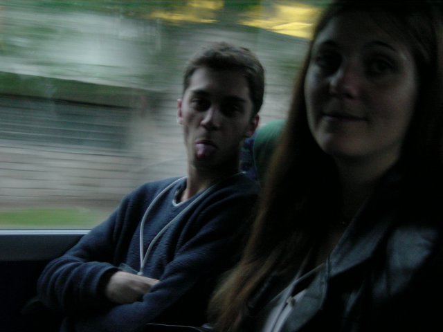 In the bus to the dinner cruise: Olivier sticking his tongue out, Coralie