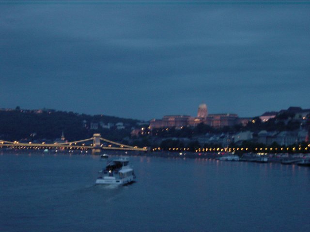 Dinner cruise on the Danube: bridge, boat, lights, twilight