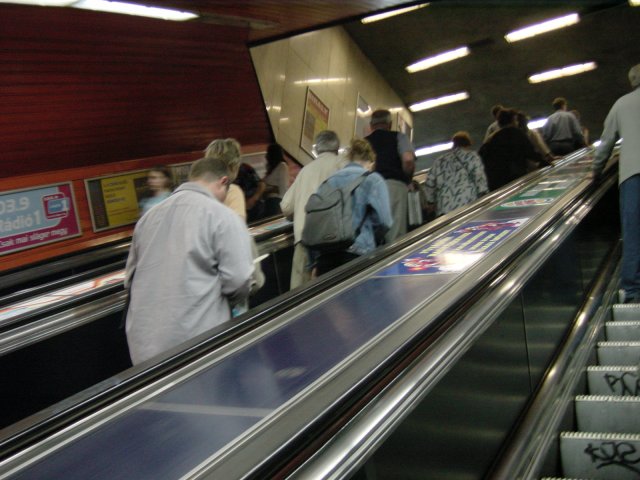 In the tube: people on the escalator