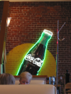 Large Coca Cola bottle on the wall