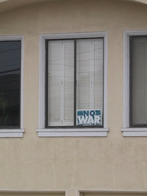 "no war... iraq" bill at a window