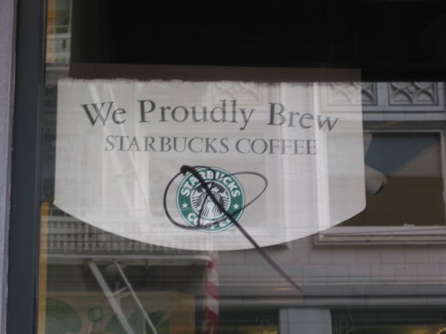 Flag reading "We proudly brew Starbucks Coffee"