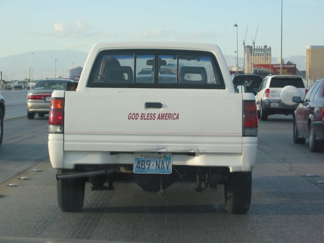 "God bless American" on the trunk of a pickup truck
