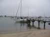 Beach, water, pier and sailing boats