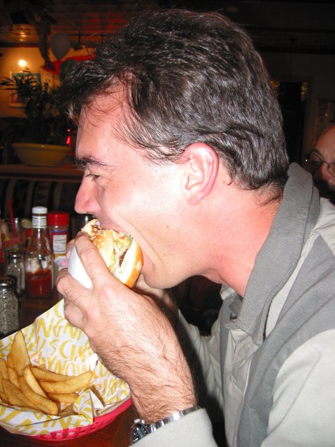 Steph biting in his hamburger