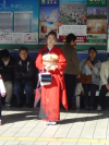 Girl wearing Japanese typical outfit waiting for the train