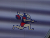 Drawing of a Japanese man running (from the side of a truck)