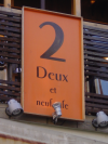 Sign reading "2 Deux et neuf cafe"