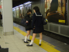 Two school girls waiting for the train