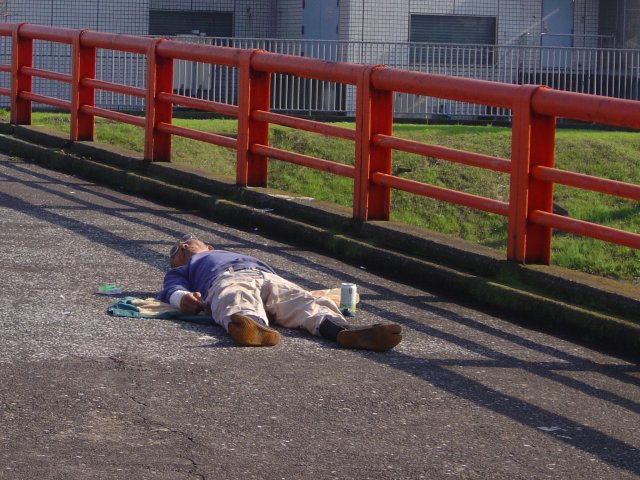 Man having a nap on the bridge