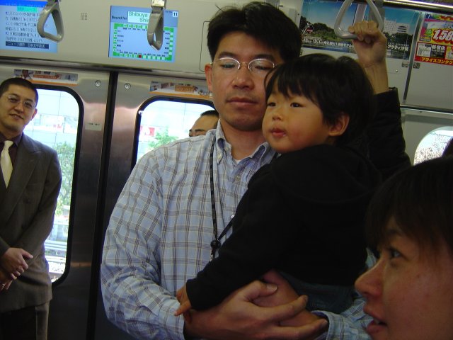 Man holding his yound son in his arms
