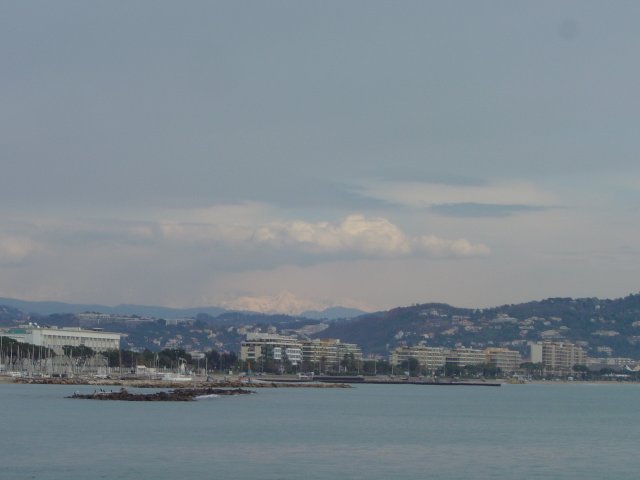 The sea, Cannes and snowy mountains (Alps) in the background