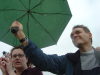 Maxf holding an umbrella over Amy while she takes a picture