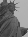 Close up of the statue of Liberty holding the table reading July 4th