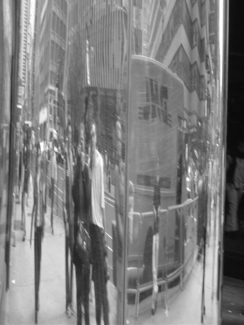 Maxf's and my reflection in a circular steel pillar
