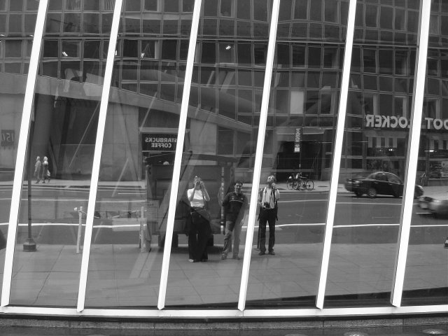 Me, Vivien and Maxf reflected in a building