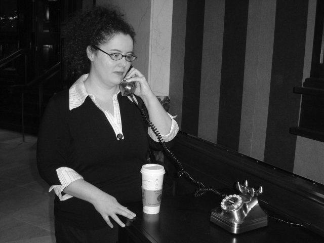 Amy using the retro telephone in the lobby of the Sheraton