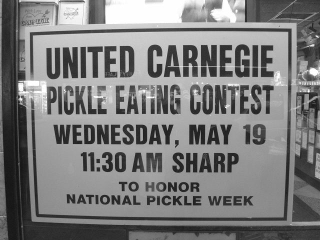 Carnegie Deli: sign in the window for "pickle eating contest"