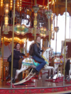 Emma and Jessica on a carousel