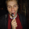Nico licking a spoon and looking inebriated