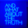 Art expo "And what about the truth" in blue neon letters 