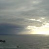 Sun beams found a way through dark clouds over the Tasman Sea