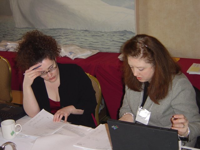 Amy van der Hiel and Susan Westhaver working at the registration desk, Hyatt Harborside, Boston